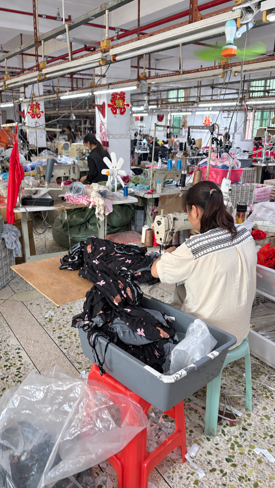 Worker sewing printed sleepwear